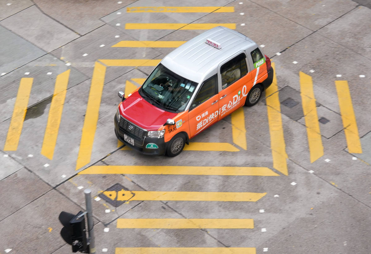 Chinese ride-hailing giants back Hong Kong plan to cap permits at 10,000